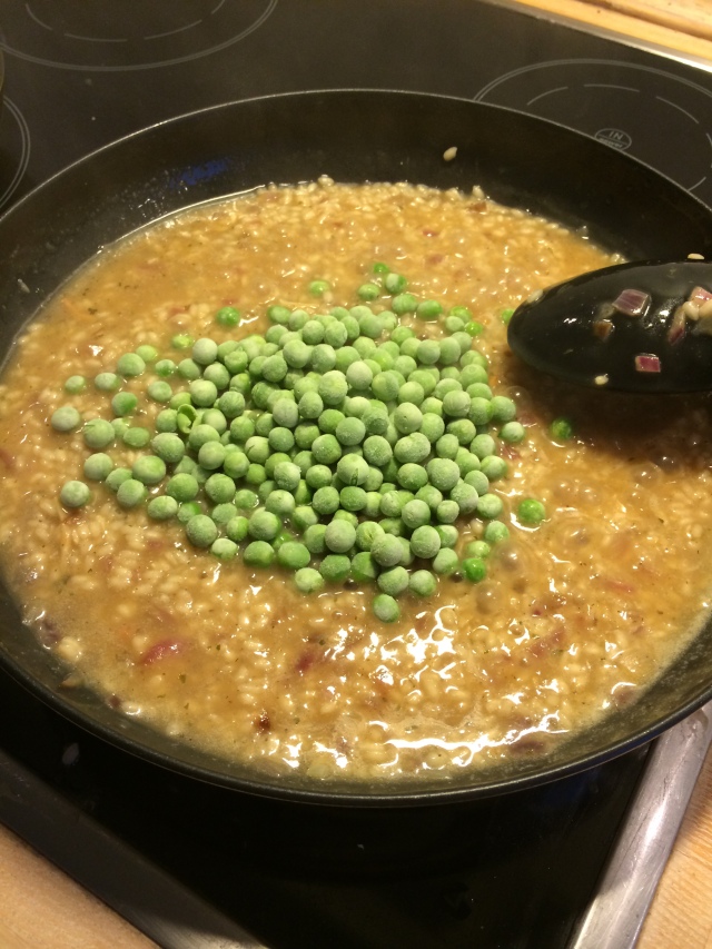 Adding the frozen peas